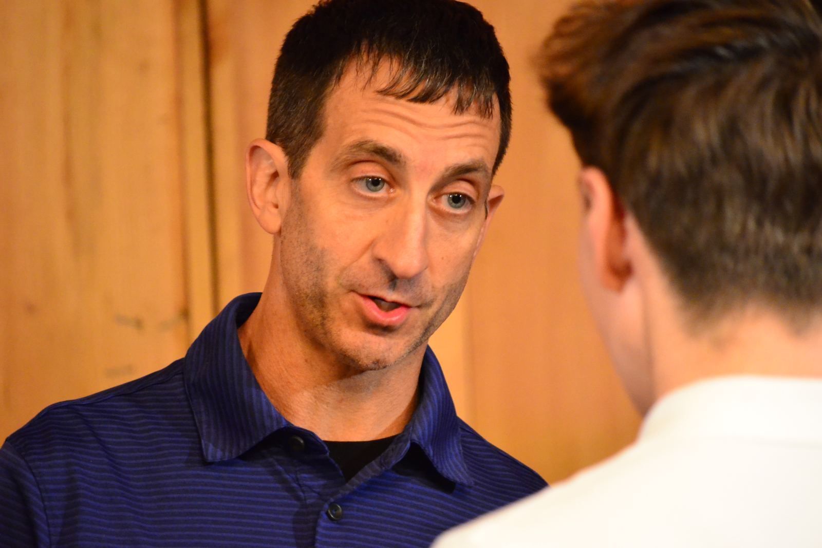 Kenny Daniels talking with a guest after the talks