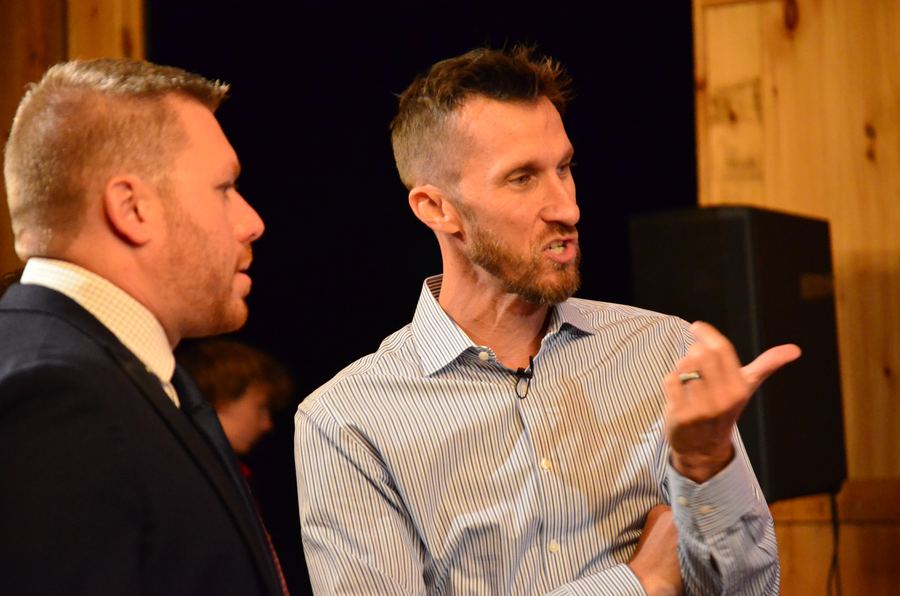 Nick Collins talking with a guest after the talks