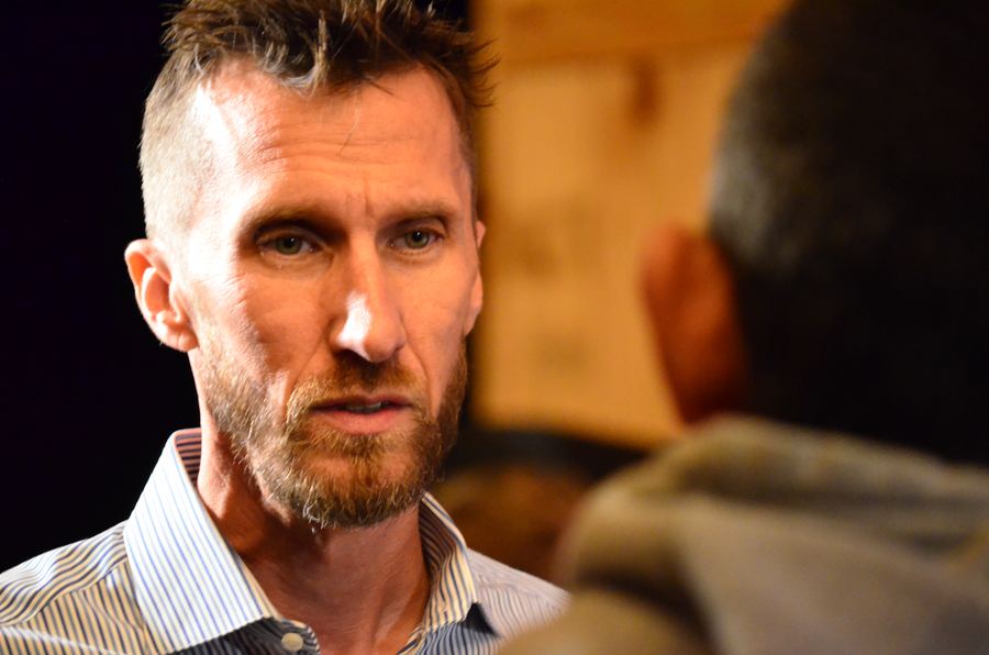 Nick Collins talking with a guest