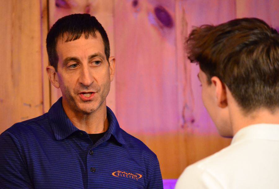 Kenny Daniels talking with a guest after the talks
