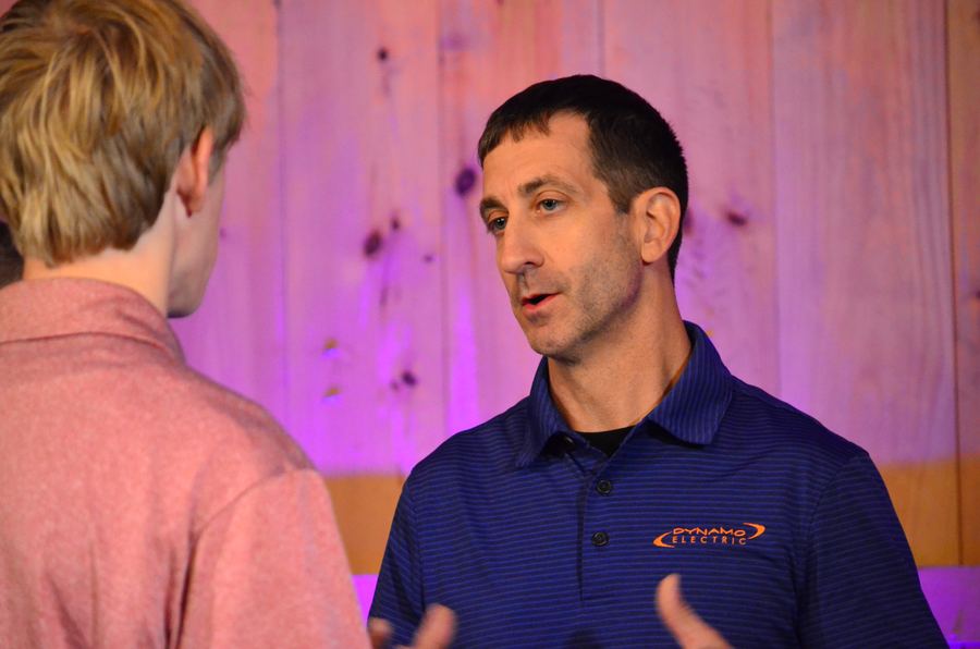 Kenny Daniels talking with a guest after the talks